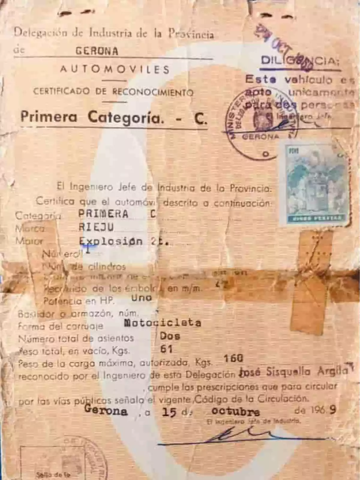 Old certificate of automobile recognition from the province of Gerona on worn paper with official stamps Old certificate of automobile recognition from the province of Gerona on worn paper with official stamps