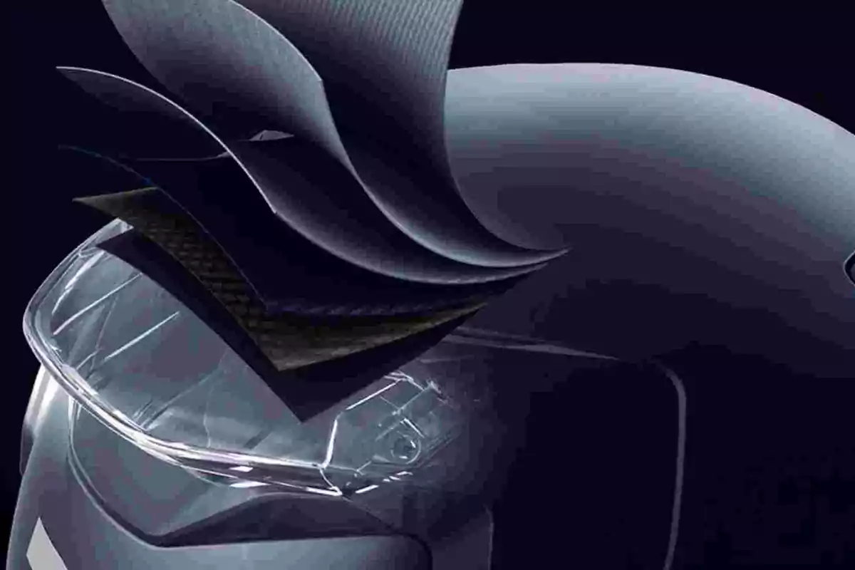 Corte transversal de un casco de motocicleta mostrando varias capas de materiales superpuestos para ilustrar su estructura y protección Corte transversal de un casco de motocicleta mostrando varias capas de materiales superpuestos para ilustrar su estructura y protección