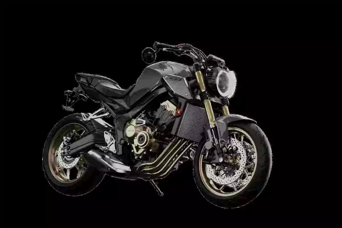 Motocicleta esportiva de color negre amb detalls daurats sobre un fons negre Motocicleta esportiva de color negre amb detalls daurats sobre un fons negre