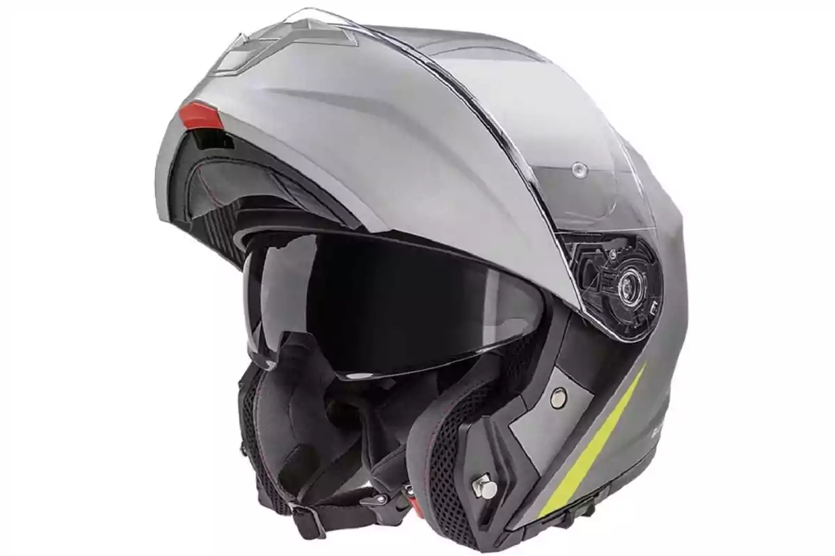 Casc modular de motocicleta de color gris amb visera transparent i detalls en groc Casc modular de motocicleta de color gris amb visera transparent i detalls en groc