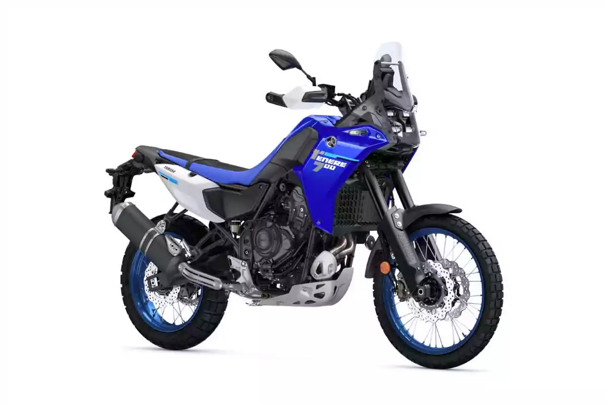 Motocicleta deportiva de color azul con detalles en blanco y negro diseñada para aventuras y terrenos difíciles Motocicleta deportiva de color azul con detalles en blanco y negro diseñada para aventuras y terrenos difíciles