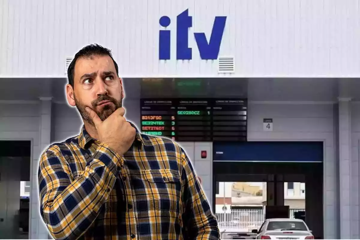Hombre preocupado mirando hacia arriba y taller de ITV de fondo Hombre preocupado mirando hacia arriba y taller de ITV de fondo